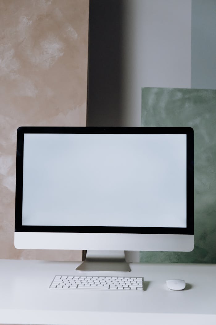 A sleek desktop computer setup in a minimalist office space with a clean design.